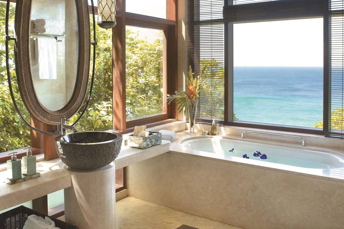 tree house villa | bathroom | separate bathtub and shower, deep-soaking bathtub, designer toiletries