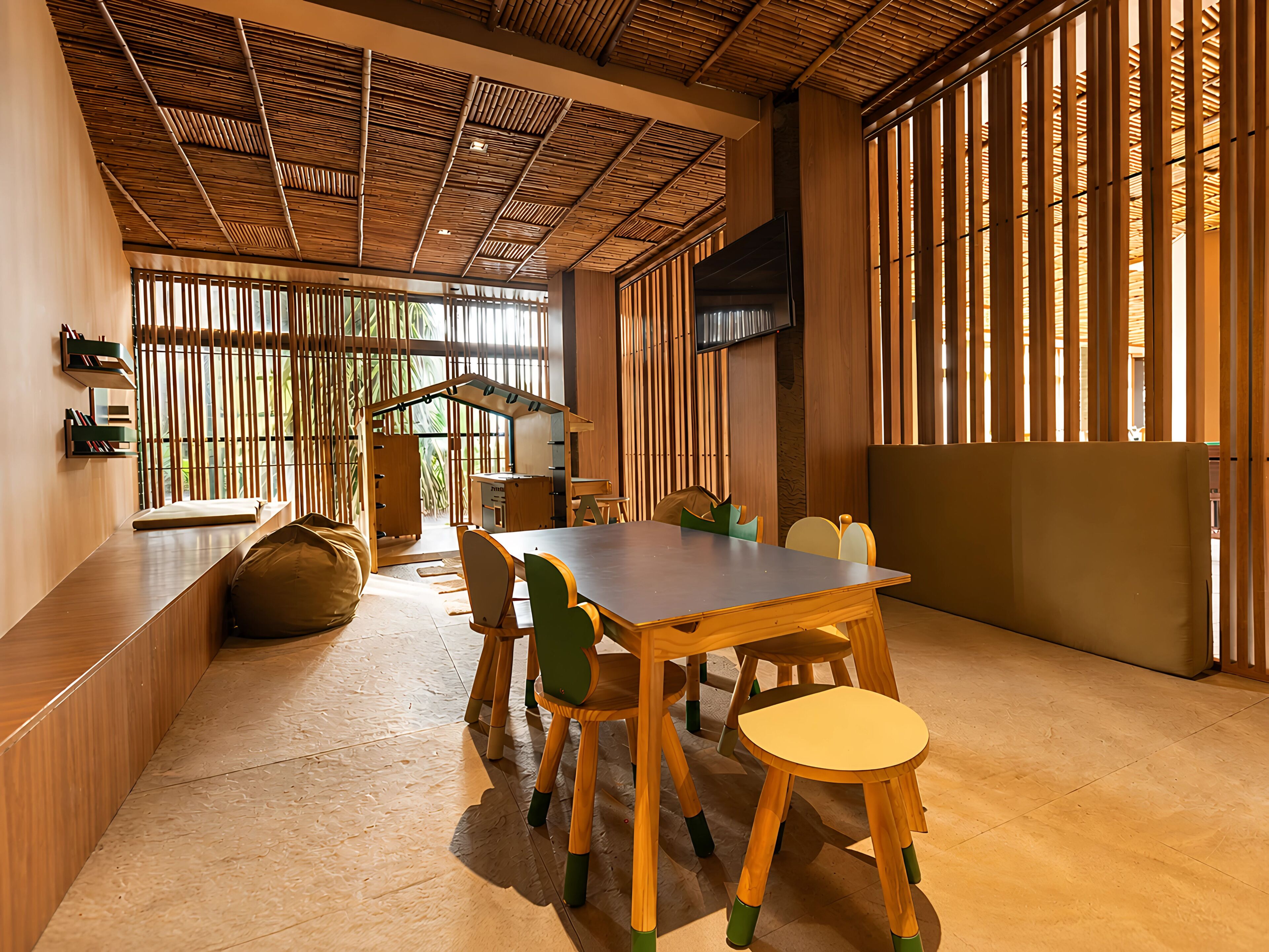 A modern interior with a wooden ceiling, large windows, and a dining area with wooden furniture.