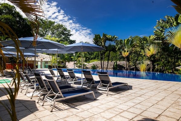 2 outdoor pools, open 8:00 AM to 9:00 PM, pool umbrellas, pool loungers