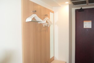 Desk, laptop workspace, blackout drapes, iron/ironing board