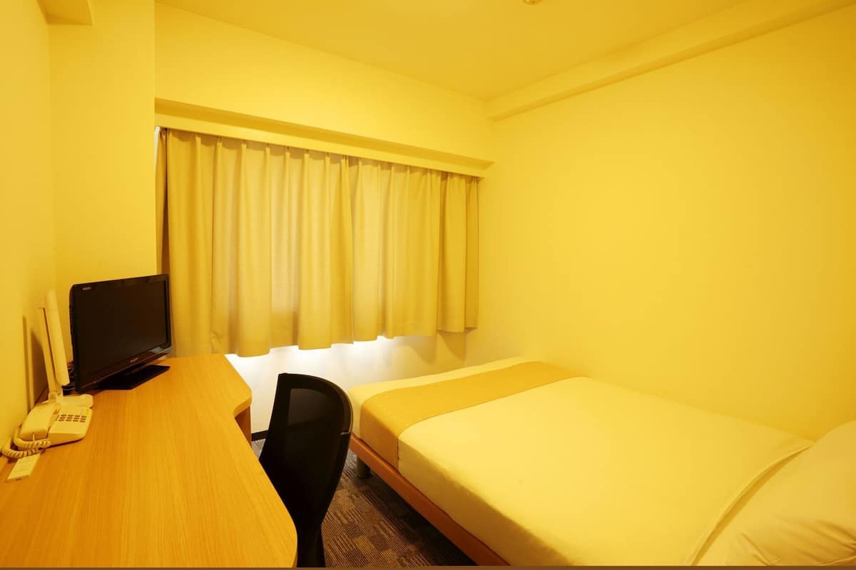 Desk, laptop workspace, blackout drapes, iron/ironing board