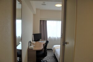 Desk, laptop workspace, blackout drapes, iron/ironing board