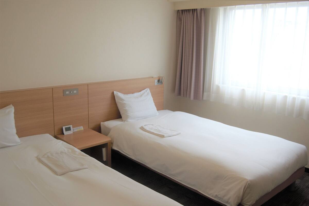 Desk, laptop workspace, blackout drapes, iron/ironing board