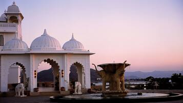 A building with domed architecture and a fountain.