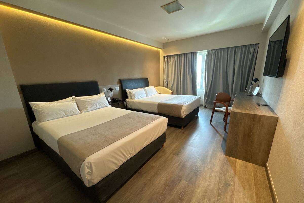 Twin Room | Minibar, in-room safe, desk, blackout curtains