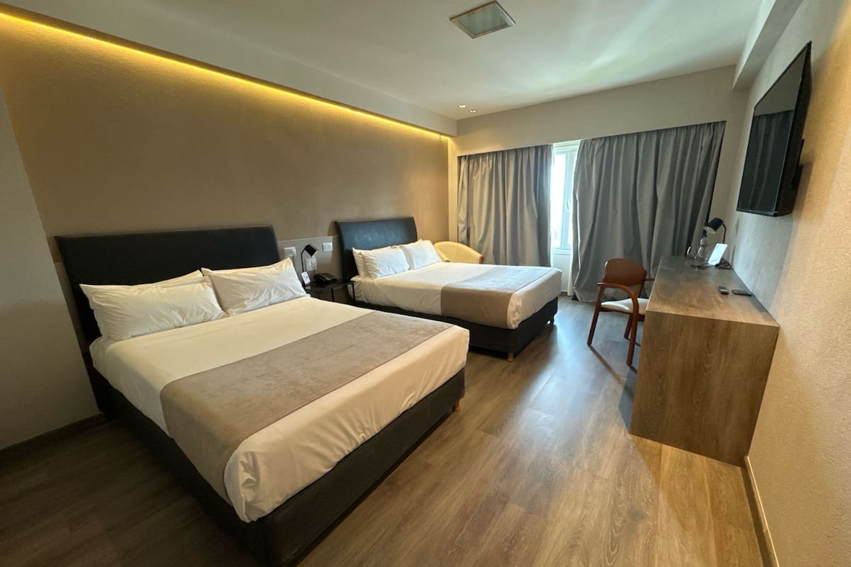 Twin Room | Minibar, in-room safe, desk, blackout drapes