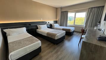 Triple Room | Minibar, in-room safe, desk, blackout curtains