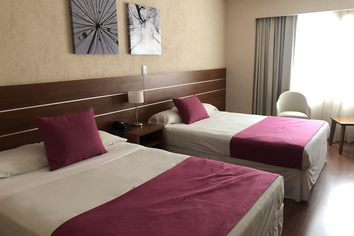 twin room | minibar, in-room safe, desk, blackout curtains
