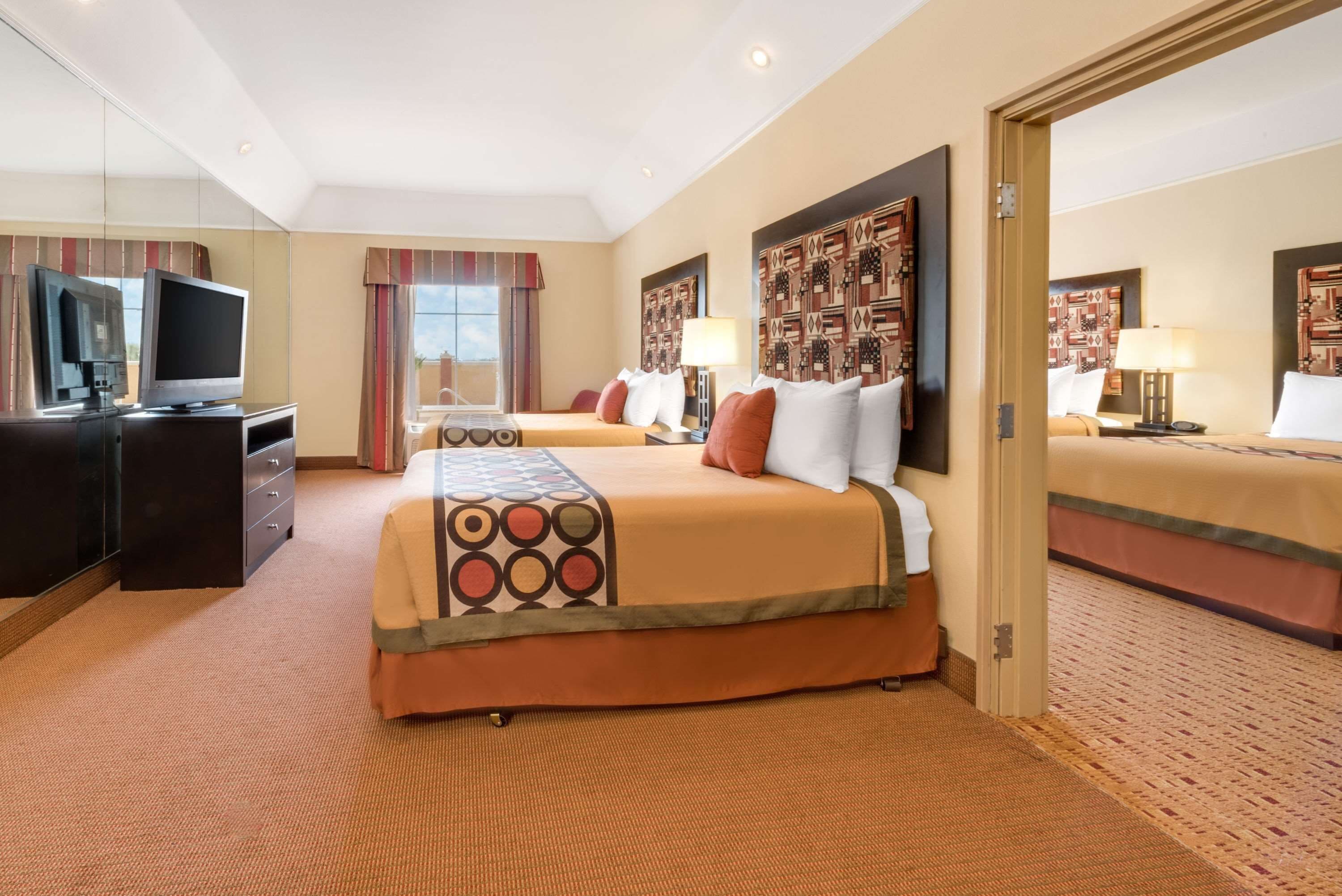 room, multiple beds, refrigerator | premium bedding, in-room safe, desk, soundproofing