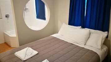 Standard Suite, 1 Bedroom, Non Smoking, Bathtub | 1 bedroom, blackout drapes, soundproofing, iron/ironing board