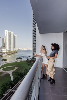 Premium bedding, minibar, desk, laptop workspace at W Miami