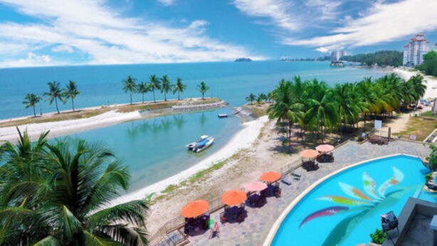 A resort with a pool, beach, and ocean view. - Corus Paradise Resort Port Dickson (Port Dickson)