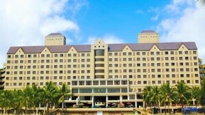 A large hotel with multiple floors, a central courtyard, and a symmetrical facade. - Corus Paradise Resort Port Dickson (Port Dickson)