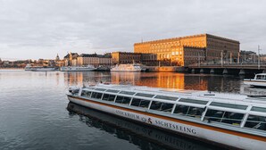 A river with a boat named "Stockholm Sightseeing" docked. - STORY HOTEL STOCKHOLM STUREPLAN, in JdV by Hyatt (Stockholm)
