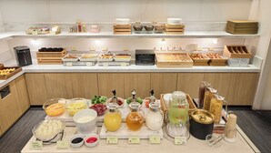 A buffet with various food items, beverages, and condiments. - Citadines Shinjuku Tokyo (Tokyo)