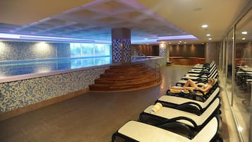 Indoor pool, open 8:00 AM to 10:00 PM, pool loungers