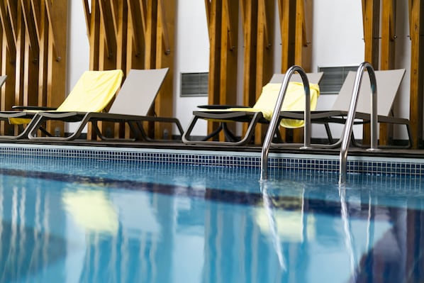 Indoor pool, open 9:00 AM to 9:00 PM, pool loungers