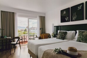 Habitación Business con 1 cama doble o 2 individuales | Caja fuerte, cortinas opacas, wifi gratis y ropa de cama