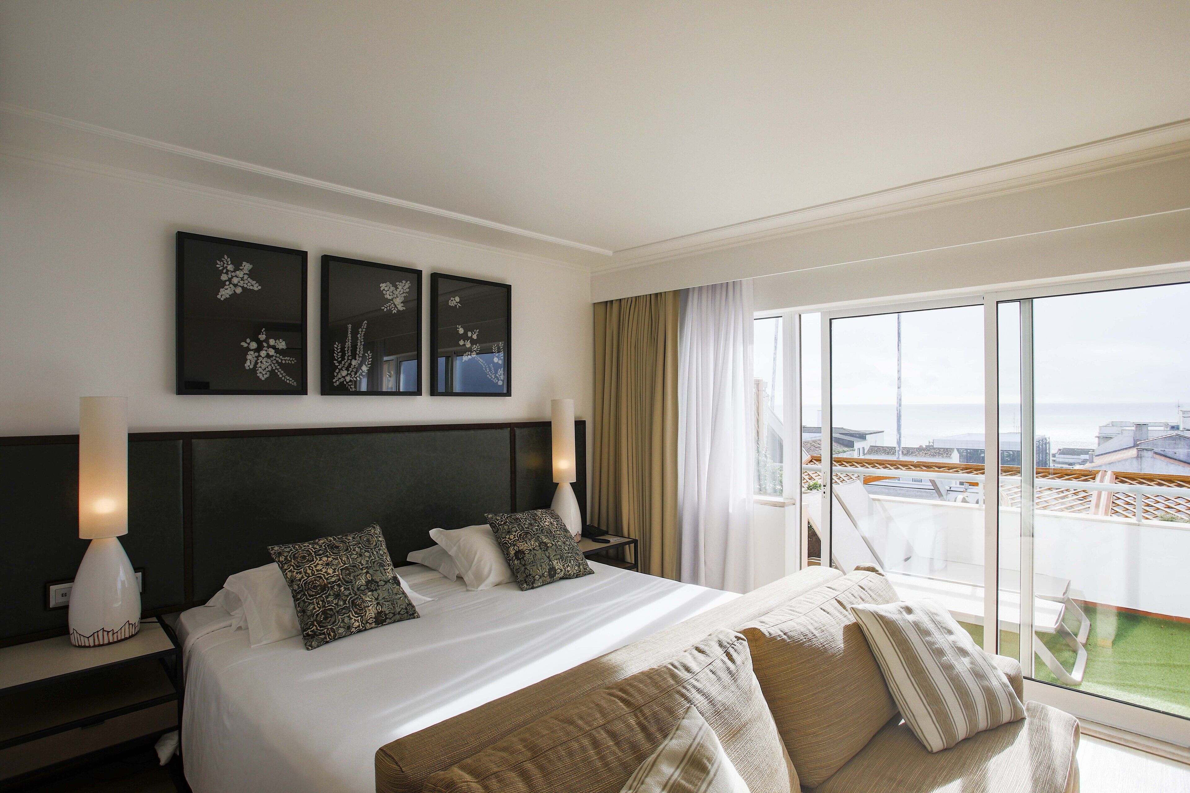 junior studio suite, 1 bedroom, balcony, ocean view | 1 bedroom, blackout curtains, free wifi, bed sheets
