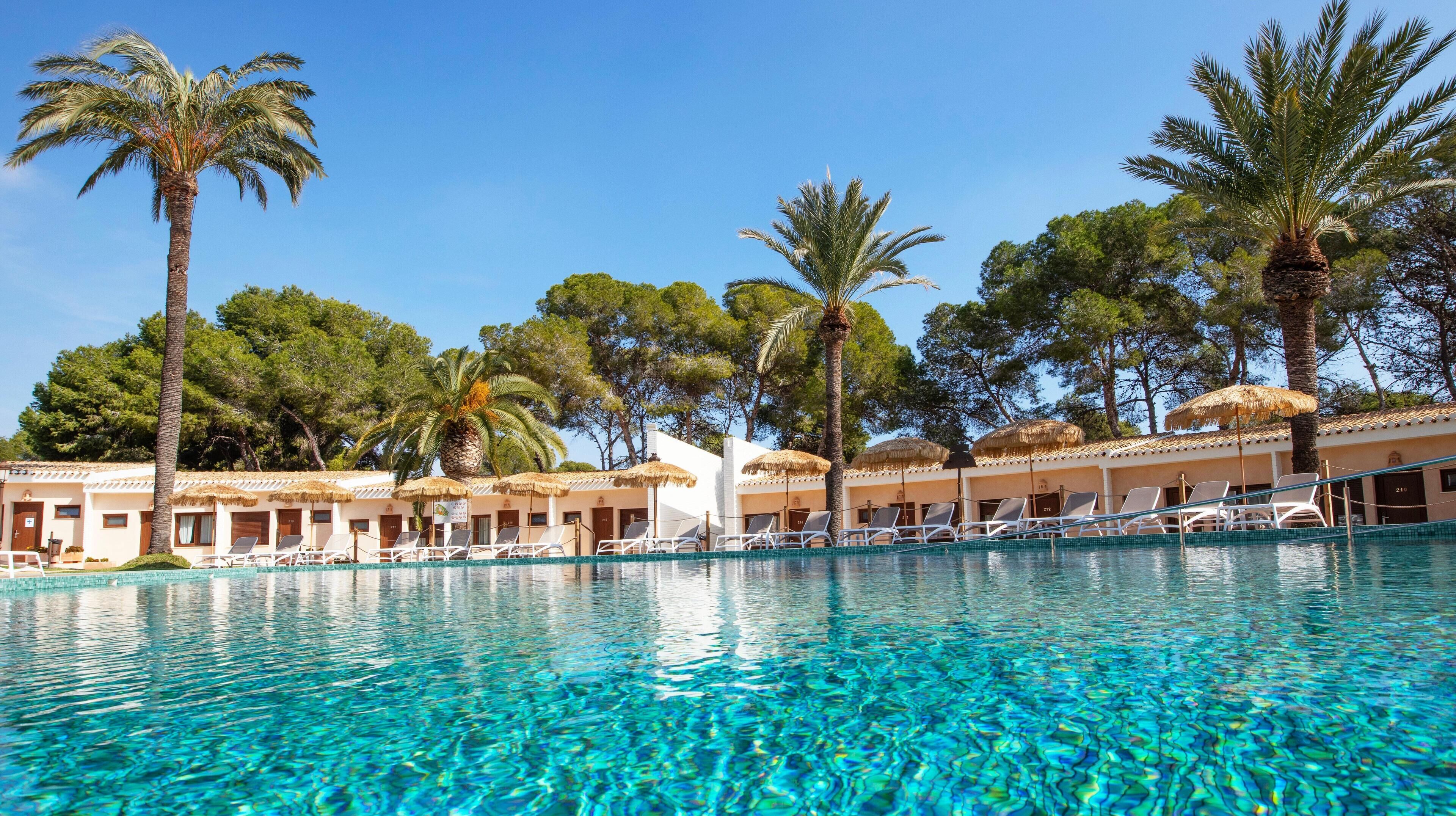 Outdoor pool, open 11:00 AM to 7:00 PM, pool umbrellas, pool loungers