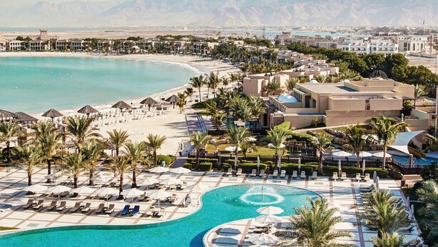 A resort with a large pool, beach, and palm trees. - Rixos Al Mairid Ras Al Khaimah (Ras Al Khaimah)