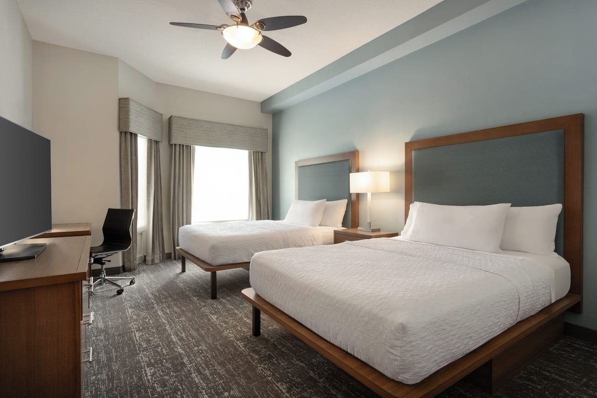 Premium bedding, pillow-top beds, desk, laptop workspace