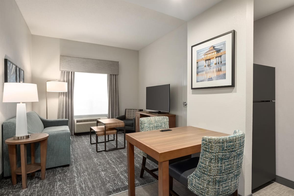 Premium bedding, pillow-top beds, desk, laptop workspace