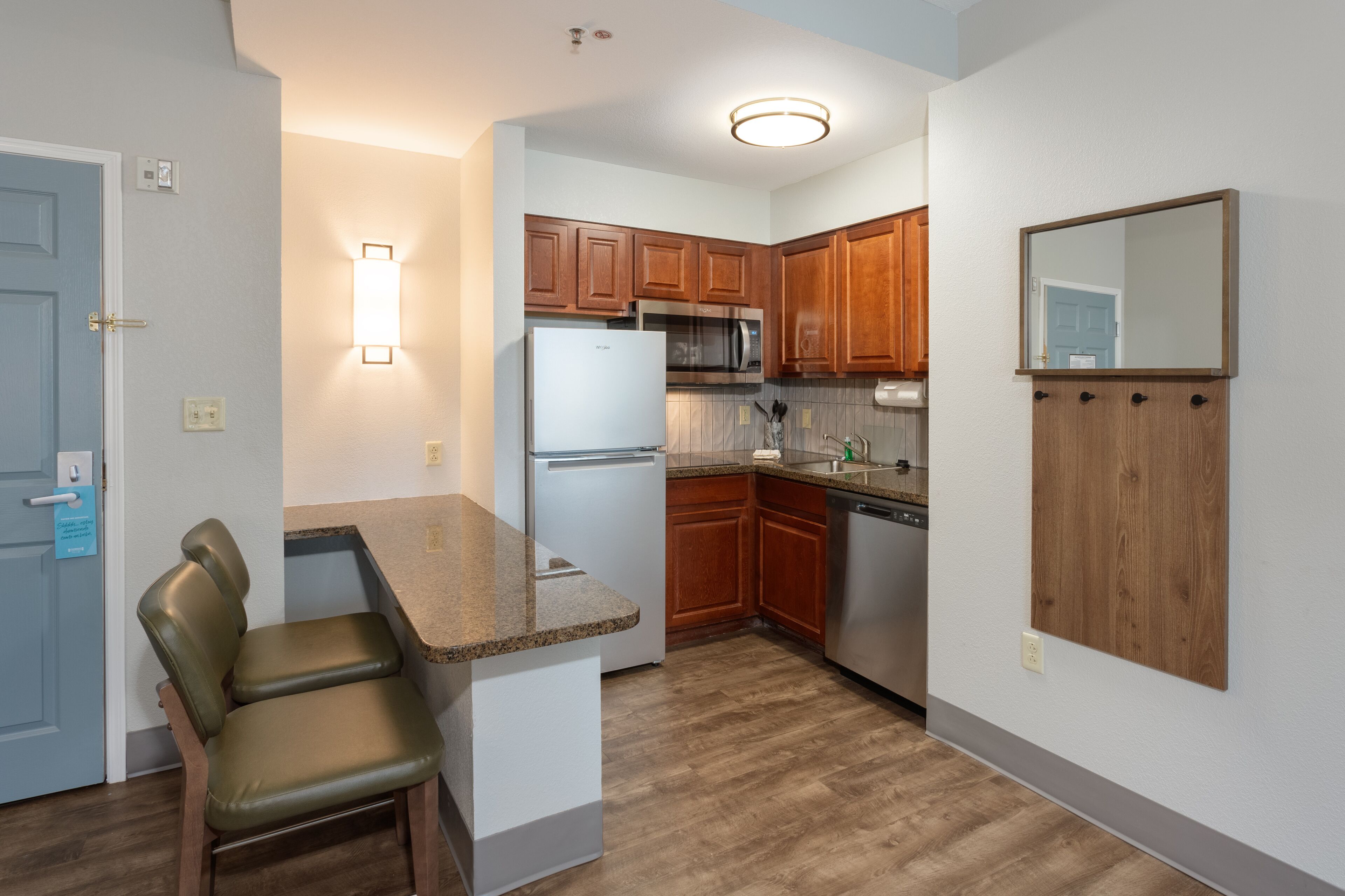 full-sized fridge, microwave, stovetop, dishwasher