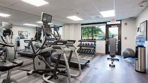 A gym with treadmills, elliptical machines, and dumbbells. - Staybridge Suites West Seneca by IHG (Buffalo)