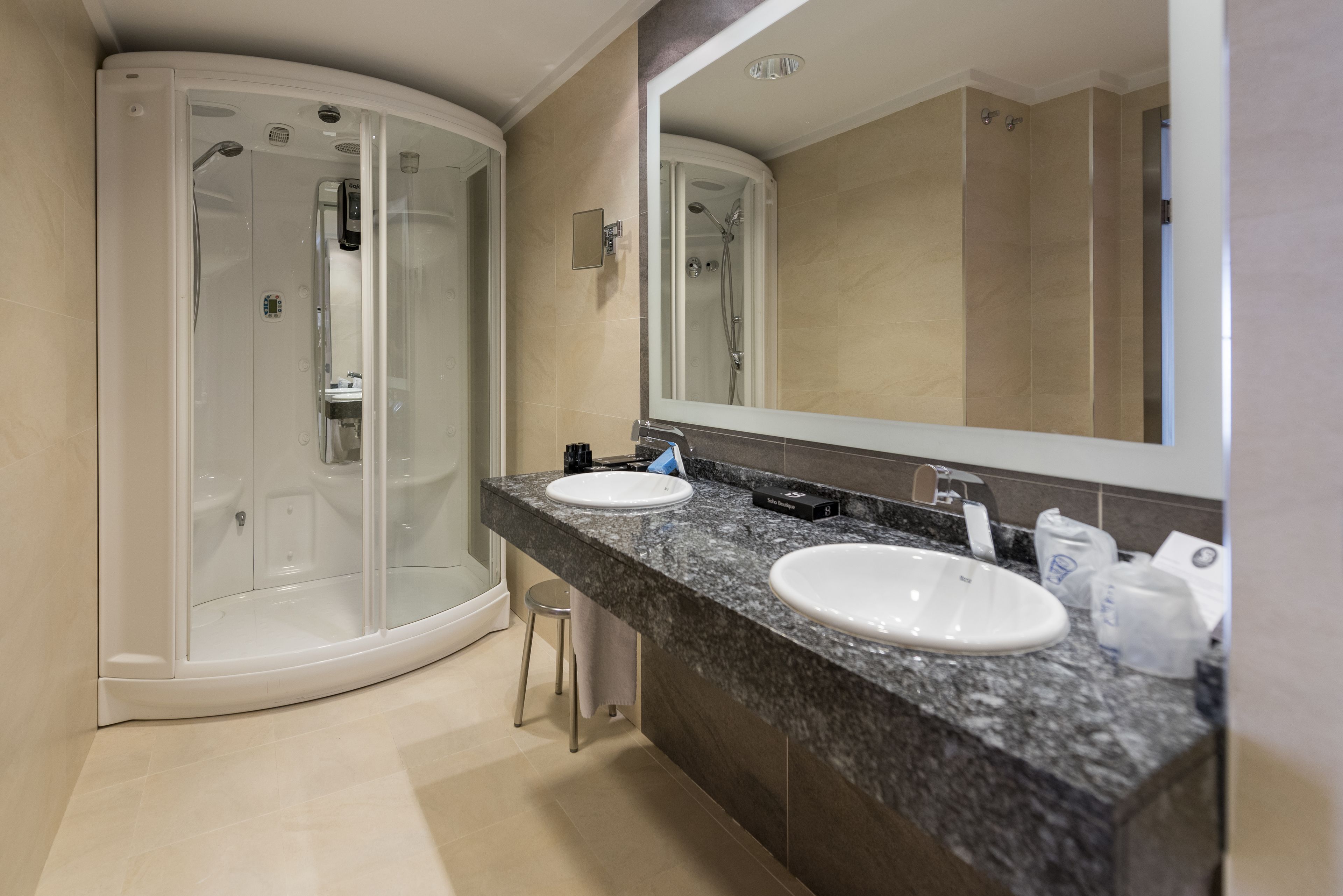 bathroom | hair dryer, bidet, towels, shampoo