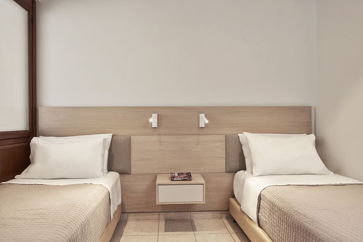Family Room, Garden View | 1 bedroom, in-room safe, desk, free WiFi