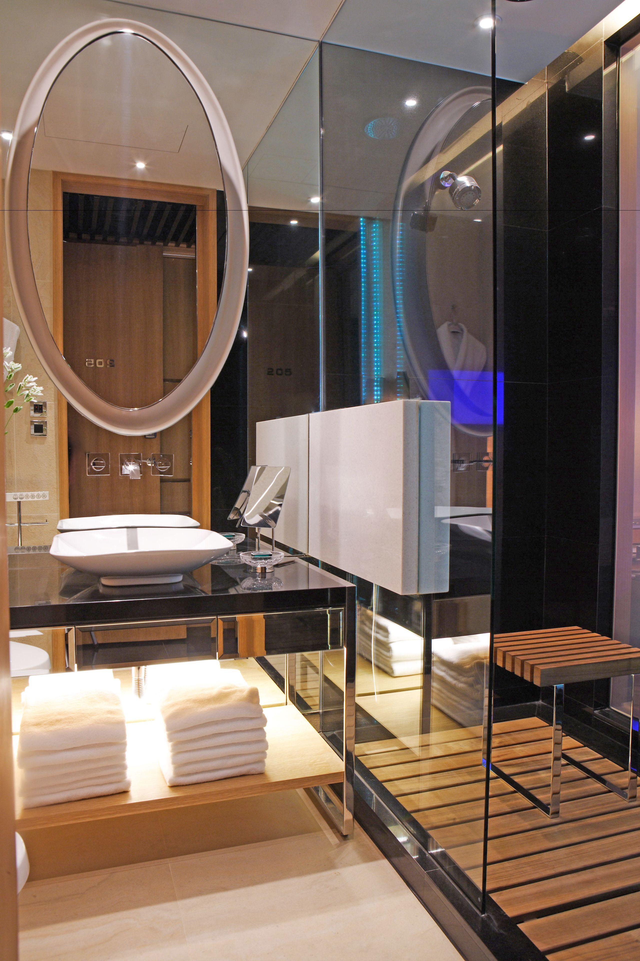 designer toiletries, hair dryer, bathrobes, slippers