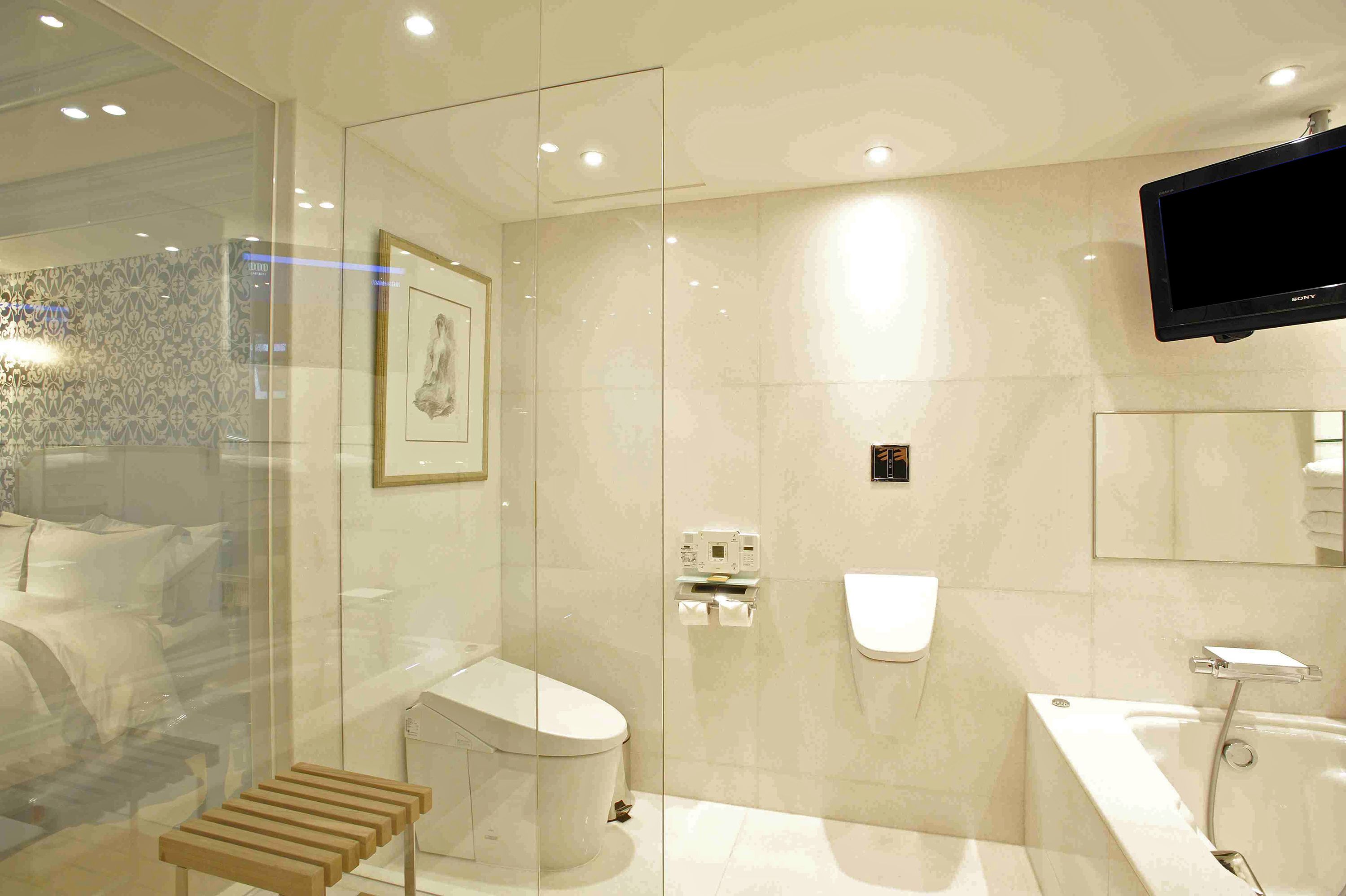 eclat suite, 1 king bed | bathroom | designer toiletries, hair dryer, bathrobes, slippers