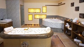 A modern bathroom with a freestanding bathtub, a large mirror, and a vanity with a sink. - Vihren Palace Ski & Spa Resort (Bansko)