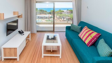 Apartment, 1 Bedroom, Sea View (Prestige) | Living area | 50-cm TV with satellite channels