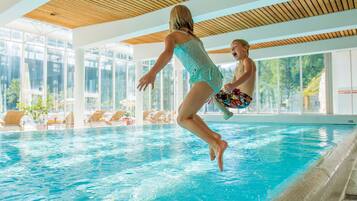 Indoor pool, outdoor pool, pool umbrellas, pool loungers