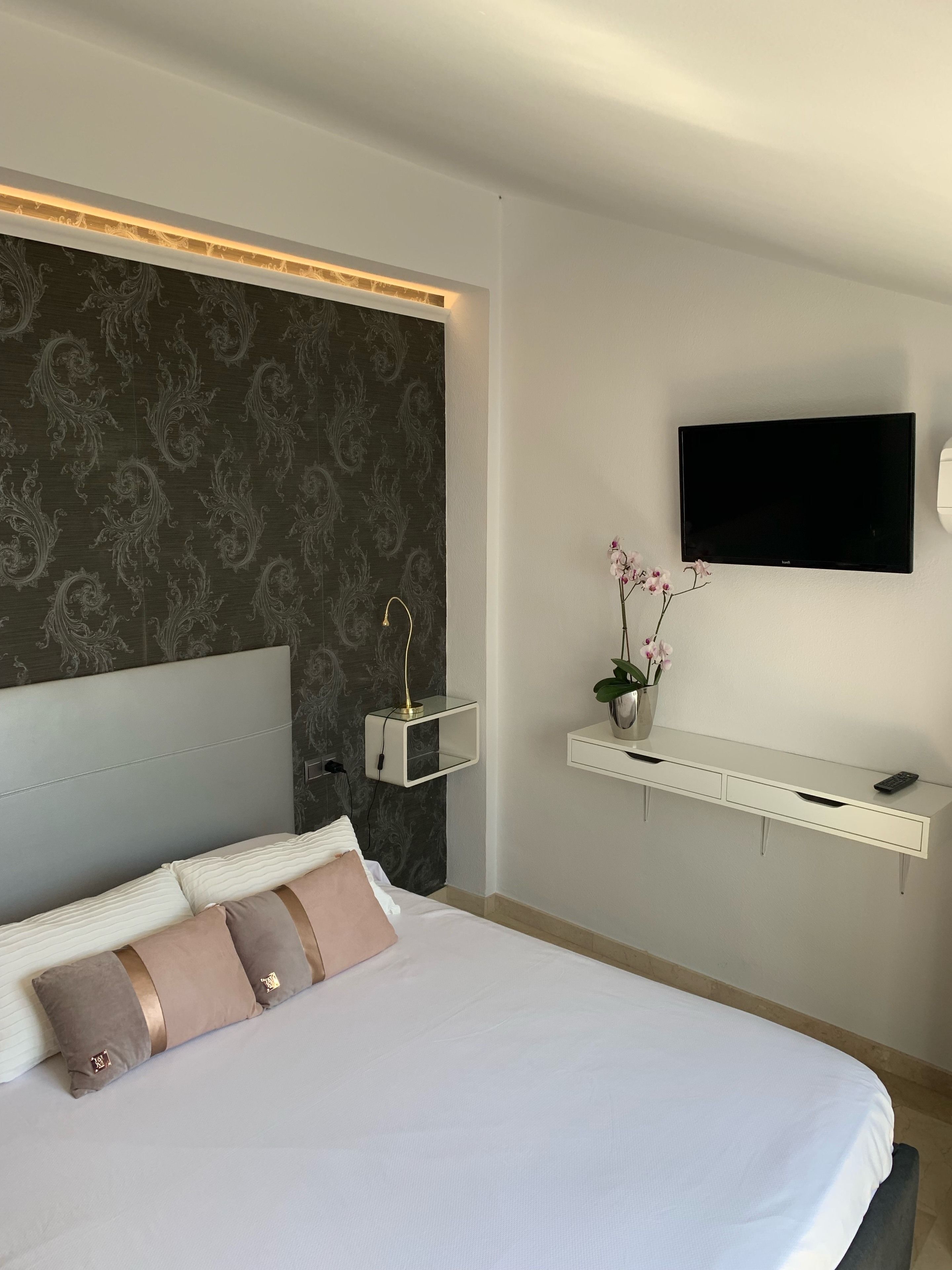 Premium bedding, down duvets, memory-foam beds, in-room safe