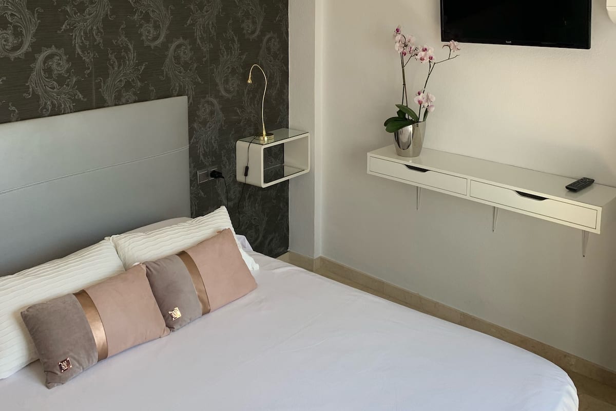 Premium bedding, down comforters, memory foam beds, in-room safe