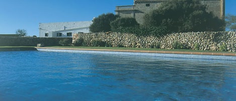 Outdoor pool, open 9:00 AM to 8:00 PM, pool loungers