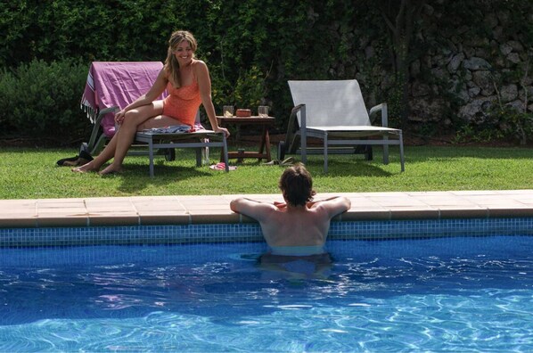 Outdoor pool, open 9:00 AM to 8:00 PM, pool loungers