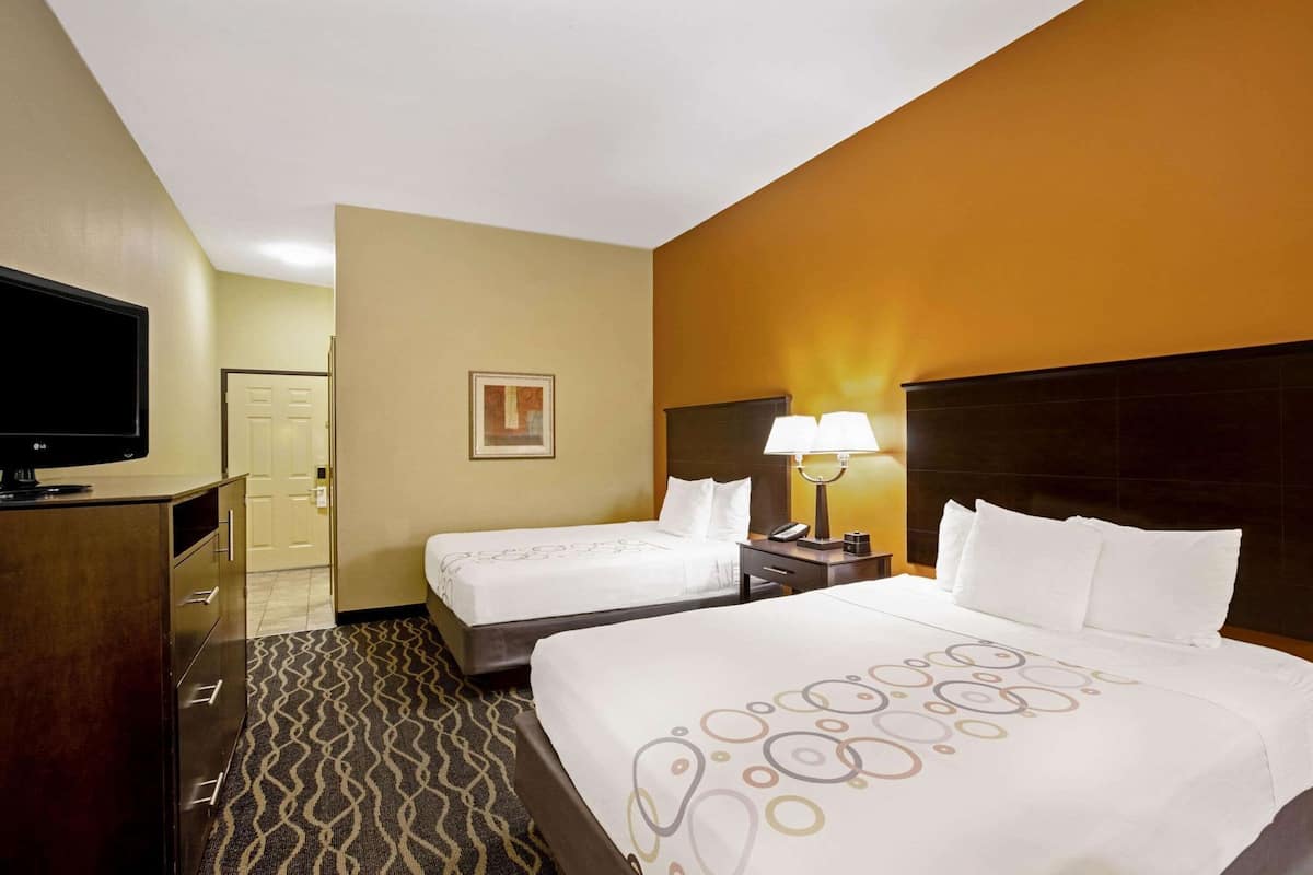 Premium bedding, desk, laptop workspace, blackout curtains