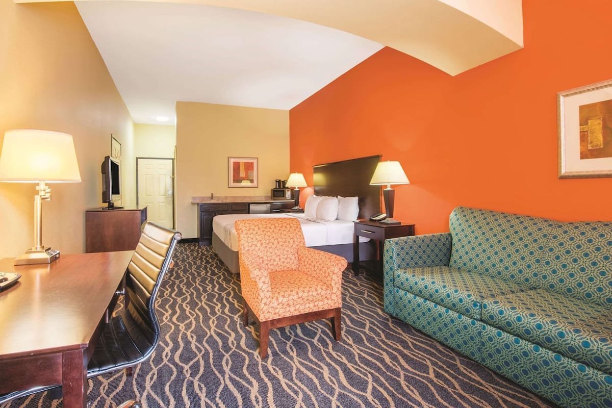Premium bedding, desk, laptop workspace, blackout curtains