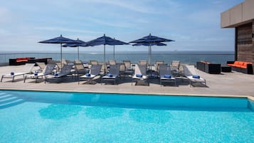 Seasonal outdoor pool, pool loungers