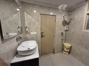 Shower, rainfall showerhead, designer toiletries, towels