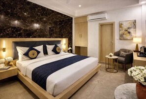 Habitación Deluxe con 1 cama matrimonial o 2 individuales | Escritorio, cortinas blackout, camas extra y wifi gratis 