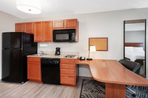 Full-size fridge, microwave, coffee/tea maker, cookware/dishes/utensils