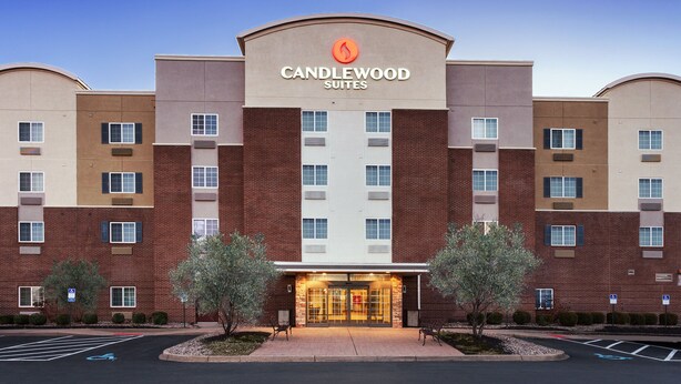 A multi-story hotel with a prominent "Candlewood Suites" sign, featuring a brick facade and a central entrance with glass doors. - Candlewood Suites Louisville North by IHG (Clarksville)