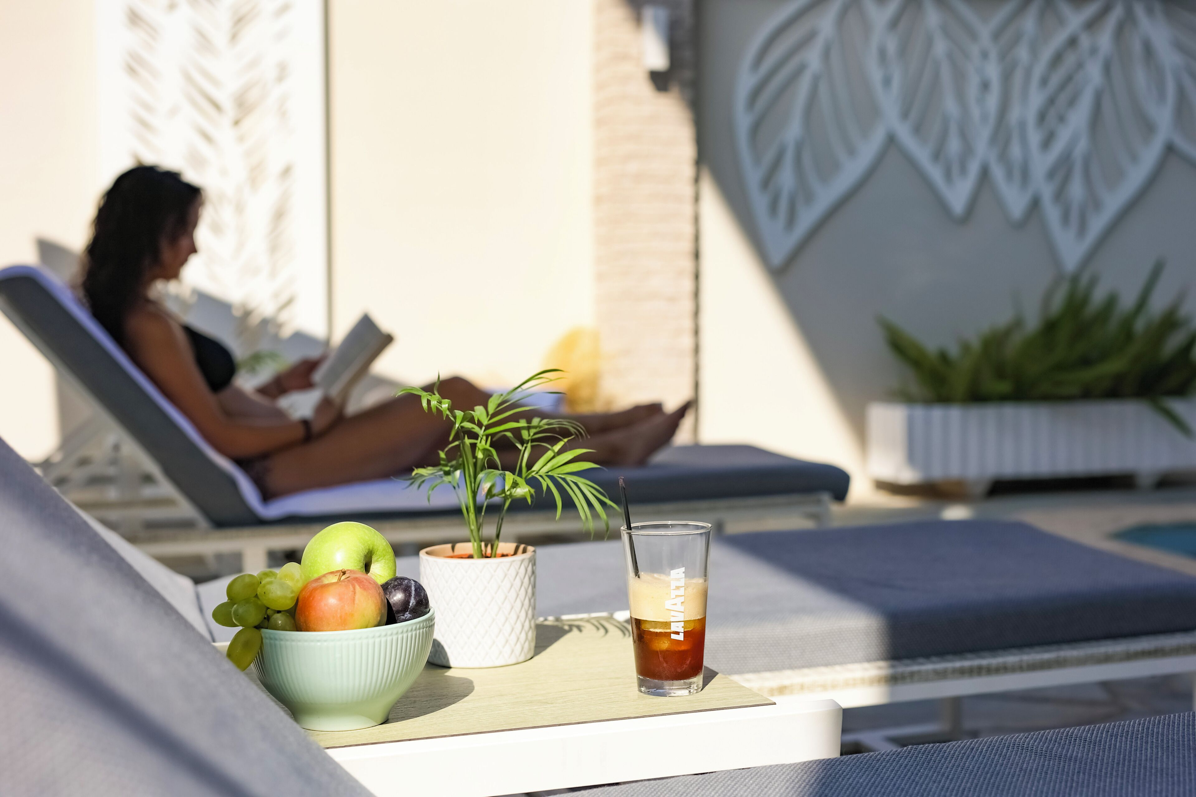 Outdoor pool, open 10:00 AM to 7:00 PM, pool loungers