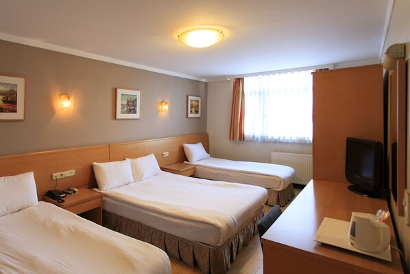 Standard Triple Room, 1 Bedroom | Minibar, in-room safe, desk, laptop workspace - Hotel Inter Istanbul (Istanbul)