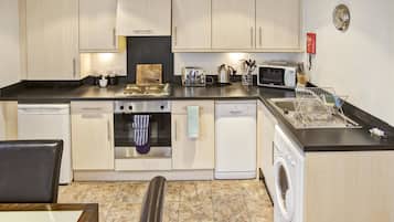 Apartment, 2 Bedrooms | Private kitchen | Fridge, microwave, stovetop, dishwasher